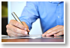 Person writing with pen